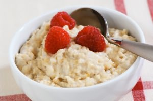 Porridge with fresh raspberries in a bowl